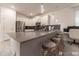 Bright kitchen with stainless appliances, sleek countertops, and a cozy breakfast bar with seating at 2816 Simile St, Kissimmee, FL 34746