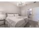 Bright bedroom featuring a plush bed and access to an ensuite bathroom at 2816 Simile St, Kissimmee, FL 34746