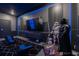 Unique entertainment room showcasing Star Wars themed decor, recliner seating, and large screen at 2816 Simile St, Kissimmee, FL 34746