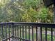 Enjoy peaceful outdoor living with a private balcony surrounded by lush greenery at 304 Spring Run Cir, Longwood, FL 32779