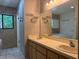 Bathroom with double sink vanity and tub offers ample space and functionality at 304 Spring Run Cir, Longwood, FL 32779