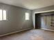 A spacious bedroom with two bright windows and closet storage creates a warm space at 304 Spring Run Cir, Longwood, FL 32779