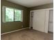 Bright bedroom includes a closet and view for a comfortable living space at 304 Spring Run Cir, Longwood, FL 32779