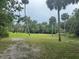 Expansive community green space with open fields and mature trees offering an oasis at 304 Spring Run Cir, Longwood, FL 32779