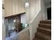 Bright entryway features a stone fireplace, staircase, and tiled flooring for a welcoming feel at 304 Spring Run Cir, Longwood, FL 32779