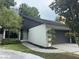 Charming two-story home featuring a well-manicured lawn and an attached two-car garage at 304 Spring Run Cir, Longwood, FL 32779