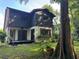 Charming backyard view of home with a private deck perfect for relaxation and entertainment at 304 Spring Run Cir, Longwood, FL 32779