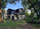 Backyard exterior view of home shows a private deck perfect for entertaining at 304 Spring Run Cir, Longwood, FL 32779