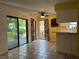 Eat-in kitchen and dining area with tile floors and sliding glass doors to the outdoor patio at 304 Spring Run Cir, Longwood, FL 32779