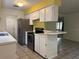 Kitchen featuring tile flooring, stainless steel appliances, and a breakfast bar at 304 Spring Run Cir, Longwood, FL 32779