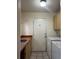 Laundry room featuring a utility sink, washer, dryer, and outdoor access at 304 Spring Run Cir, Longwood, FL 32779