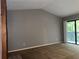 Bright room includes a private balcony with sliding glass doors and vaulted ceilings at 304 Spring Run Cir, Longwood, FL 32779