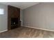 Spacious living room boasts a wood-trimmed fireplace and plush carpeting, perfect for cozy gatherings at 304 Spring Run Cir, Longwood, FL 32779