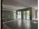 Spacious living area with mirrored walls, sliding glass doors, and stone fireplace at 304 Spring Run Cir, Longwood, FL 32779