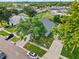 Aerial view of the property showcases the neighborhood with trees at 38 Jett Loop, Apopka, FL 32712
