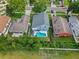 Aerial view of the home showcasing a backyard swimming pool and well-maintained landscaping at 38 Jett Loop, Apopka, FL 32712