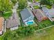 Aerial view of the home featuring a backyard swimming pool and lush greenery at 38 Jett Loop, Apopka, FL 32712