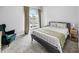 Bedroom featuring a neutral color palette, large window, and carpeted floors at 38 Jett Loop, Apopka, FL 32712
