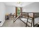 Bedroom featuring a bunk bed with a slide, a neutral color palette, and carpeted floors at 38 Jett Loop, Apopka, FL 32712