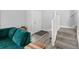 Entryway with wood-look floors, carpeted stairs, and a comfortable seating area at 38 Jett Loop, Apopka, FL 32712