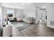Inviting living room with desk, media center, and stylish floral rug at 38 Jett Loop, Apopka, FL 32712