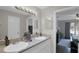 Bright bathroom with double sinks, stone countertops, and updated fixtures, conveniently located near the bedroom at 4217 Ilene Ct, Orlando, FL 32806