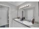 Modern bathroom with dual sinks, granite countertops, and contemporary fixtures at 4217 Ilene Ct, Orlando, FL 32806