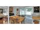 Dining room with table and chairs, stone fireplace, access to outdoor space at 4217 Ilene Ct, Orlando, FL 32806