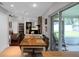 Dining room featuring table and chairs, stone fireplace, access to outdoor space at 4217 Ilene Ct, Orlando, FL 32806