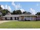 Charming single-story home boasts stone accents and a well-manicured front lawn at 4217 Ilene Ct, Orlando, FL 32806