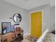 The foyer showcases a bright yellow door and decorative elements at 4217 Ilene Ct, Orlando, FL 32806