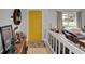 Bright foyer featuring a vibrant yellow door and a glimpse into the cozy living space at 4217 Ilene Ct, Orlando, FL 32806