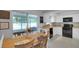 Dining room with table alongside kitchen and screened patio at 4217 Ilene Ct, Orlando, FL 32806