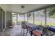 View of the enclosed patio space, complete with furniture and grill, perfect for outdoor dining and relaxation at 4217 Ilene Ct, Orlando, FL 32806