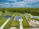 Home with a well-manicured lawn and a paved driveway, surrounded by a lush, green landscape at 4266 La Salle Ave, St Cloud, FL 34772