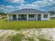 Backyard featuring a covered patio and green grass at 4266 La Salle Ave, St Cloud, FL 34772