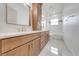 This bathroom features double sinks, a large mirror and a combined shower and tub at 4266 La Salle Ave, St Cloud, FL 34772