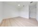 This bedroom features a ceiling fan, and light wood-look flooring at 4266 La Salle Ave, St Cloud, FL 34772