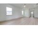 Spacious bedroom with neutral walls, a ceiling fan and two windows at 4266 La Salle Ave, St Cloud, FL 34772