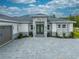 Elegant entryway with double doors and a stylish stone facade at 4266 La Salle Ave, St Cloud, FL 34772