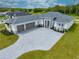 Exterior of a home with a gray brick driveway and manicured landscaping at 4266 La Salle Ave, St Cloud, FL 34772
