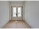 Bright foyer with decorative glass double doors and light wood flooring at 4266 La Salle Ave, St Cloud, FL 34772