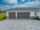 Spacious two-car garage with brick-paved driveway and modern design at 4266 La Salle Ave, St Cloud, FL 34772