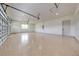 Spacious three-car garage with epoxy flooring, ample lighting, and overhead storage capability at 4266 La Salle Ave, St Cloud, FL 34772