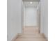 Bright hallway featuring light wood floors, neutral walls, and crisp trim at 4266 La Salle Ave, St Cloud, FL 34772