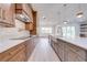 Wide shot of the kitchen featuring modern appliances and wood-look flooring at 4266 La Salle Ave, St Cloud, FL 34772