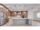 Spacious kitchen with stainless steel appliances, a large island, and ample cabinet space at 4266 La Salle Ave, St Cloud, FL 34772