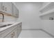 This laundry room has shelving and plenty of counter space at 4266 La Salle Ave, St Cloud, FL 34772