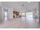 Spacious open-concept living area with modern lighting, a large island, and backyard views at 4266 La Salle Ave, St Cloud, FL 34772