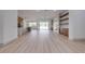 Open-concept living room with fireplace, built-ins, and seamless flooring at 4266 La Salle Ave, St Cloud, FL 34772